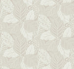 A seamless pattern featuring intricately designed leaves in light beige and cream hues. Each leaf has unique, detailed line work, creating a textured and elegant Vinca Smokey Blue Wallpaper Blue (60 Sq.Ft). The overlapping leaves form a harmonious and calming visual while the durable material from York Wallcoverings makes it easy to hang and remove.