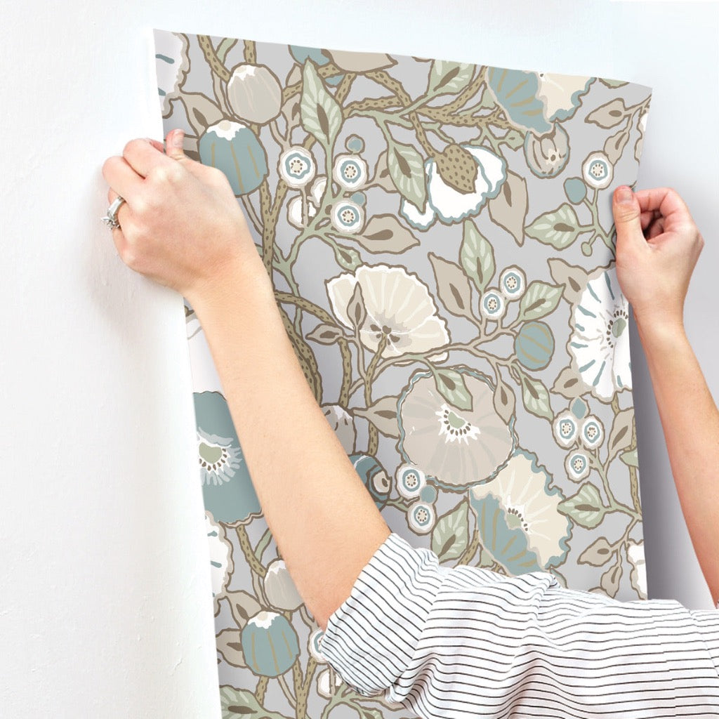 grey beige floral wallpaper hanging on the wall