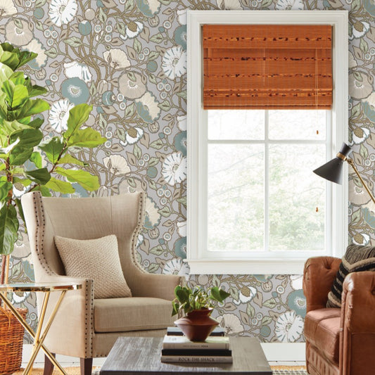 grey beige floral wallpaper on the wall, beautiful beige chair and brown leather sofa