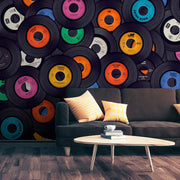 Living Room - A stylish living room with a dark green sofa, patterned cushions, and a white round coffee table. The wall is adorned with a nostalgic theme via a Decor2Go Wallpaper Mural.