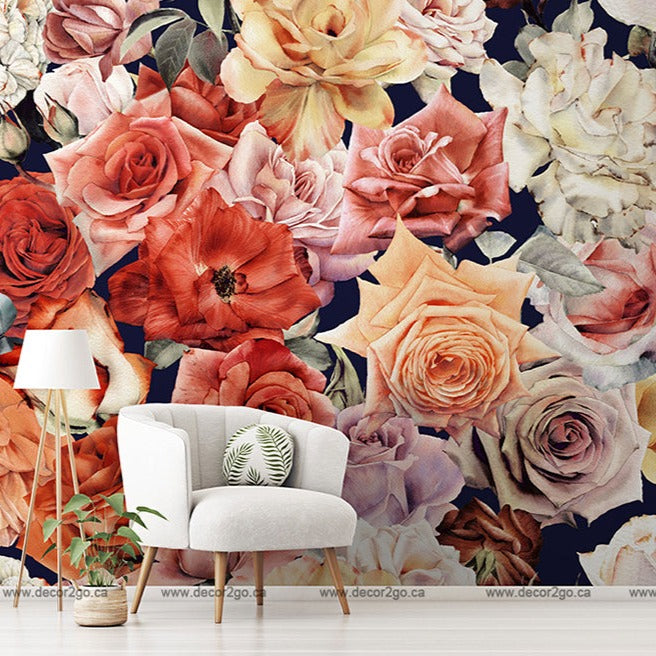 A stylish interior room with a white armchair, a small plant on its side, and a floor lamp, against an elegant Wall of Roses Wallpaper Mural featuring large crimson and cream roses from Decor2Go Wallpaper Mural.