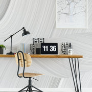 Home Office - A modern home office desk with a digital clock, lamp, framed map, decorative books, a plant, and a mug. A minimalist chair sits under the desk against Decor2Go Wallpaper Mural.