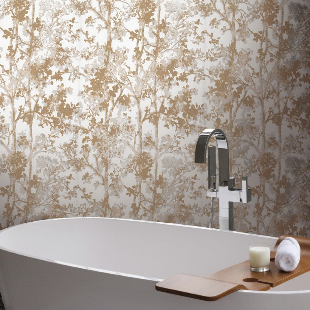 Bathroom - A modern has a white freestanding tub with a chrome faucet and a wooden bath tray holding a candle and rolled towel. The White & Gold Shimmering Foliage Wallpaper by York Wallcoverings adds an elegant touch to the space