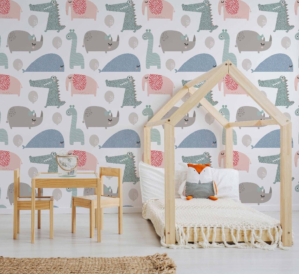 Bedroom - A child's bedroom featuring a wooden house-shaped bed frame with a white cover and fox pillow, a small wooden table and chairs, and walls adorned with Decor2Go Wallpaper Mural depicting vibrant colors and cute animal figures.