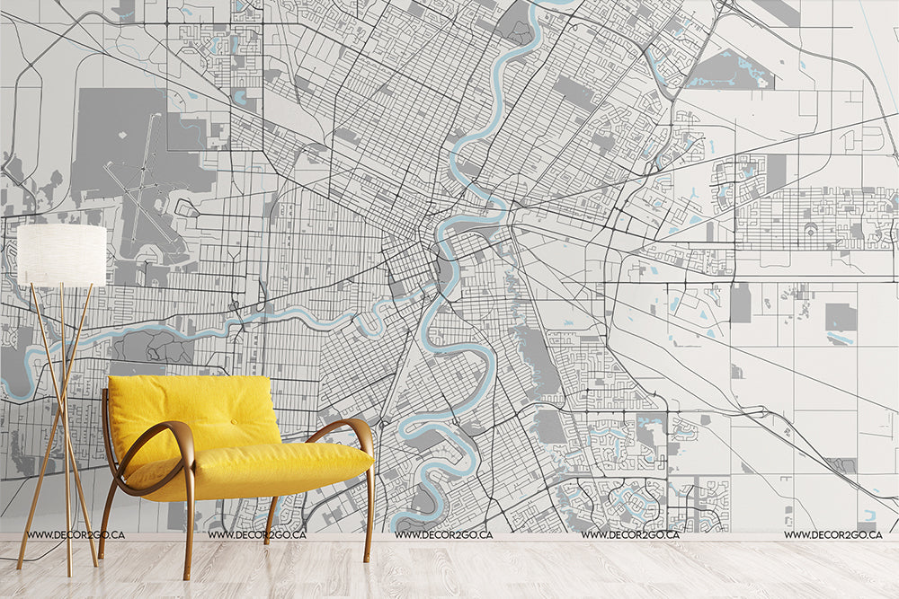 A stylish interior with a bright yellow modern armchair and a white floor lamp, set against a feature wall of a detailed Decor2Go Wallpaper Mural with blue river accents.