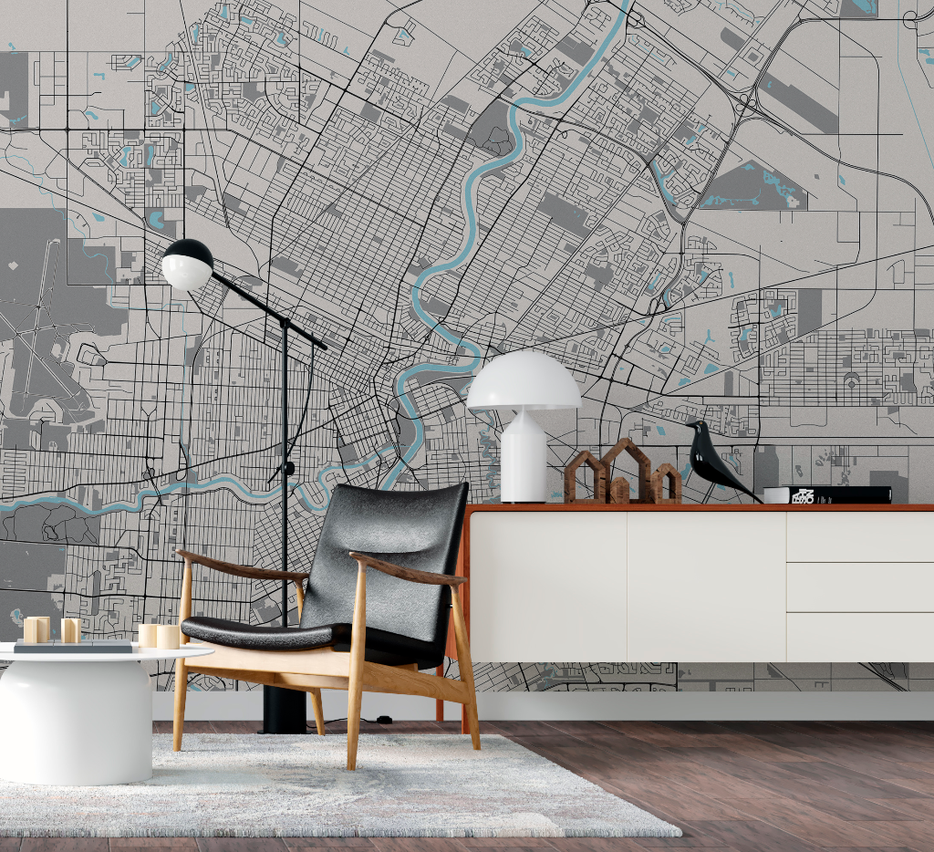 A stylish modern living room with a Decor2Go Wallpaper Mural, featuring a comfy chair, a sideboard and decorative items including a lamp and bird figurines.
