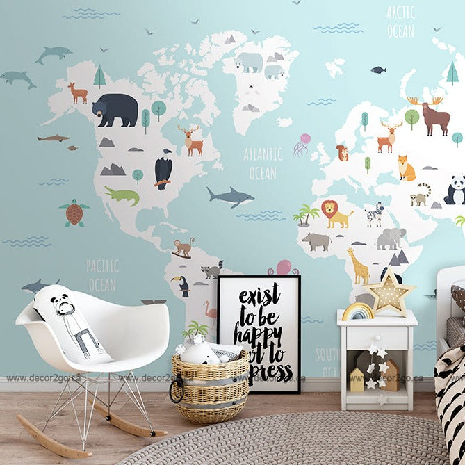 A child's room with a Decor2Go Wallpaper Mural depicting animals on each continent, a white modern chair, a wicker basket, and decorative items on a small shelf.