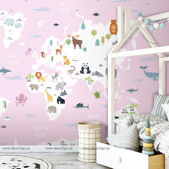 A child's bedroom with World Map with Wild Animals Pink wallpaper mural from Decor2Go Wallpaper Mural featuring arctic and oceanic regions, a white bed frame, and a decorative basket.