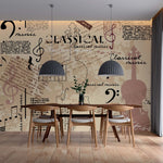 A modern dining area with a table and chairs against a wall decorated with a Decor2Go Wallpaper Mural featuring musical symbols and musical notes in various fonts, emphasizing an artistic theme.