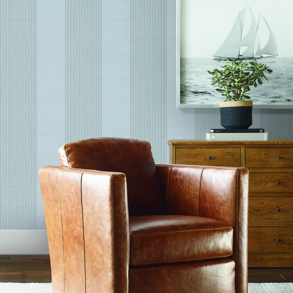 Living room with 'Archer Stripe' wallpaper in Light Blue-Grey by York Wallcoverings, creating a serene, stylish space.