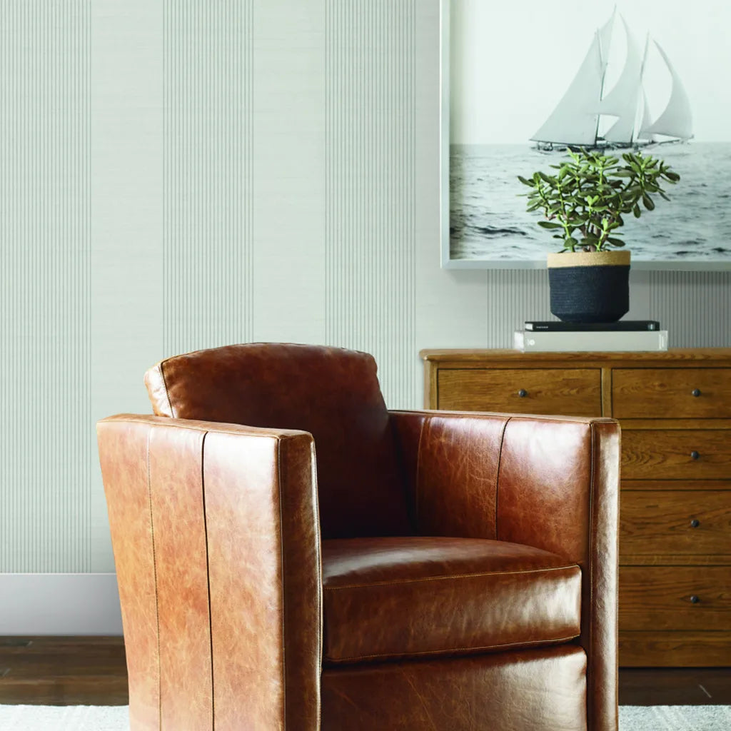 Living room with Archer Stripe wallpaper in Light Grey by York Wallcoverings, adding modern sophistication.