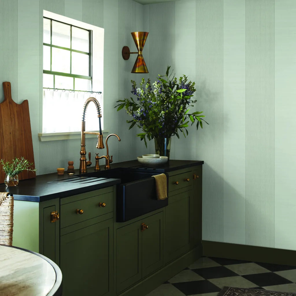 Sage Green Archer Stripe wallpaper by York Wallcoverings adds modern charm to this inviting interior.