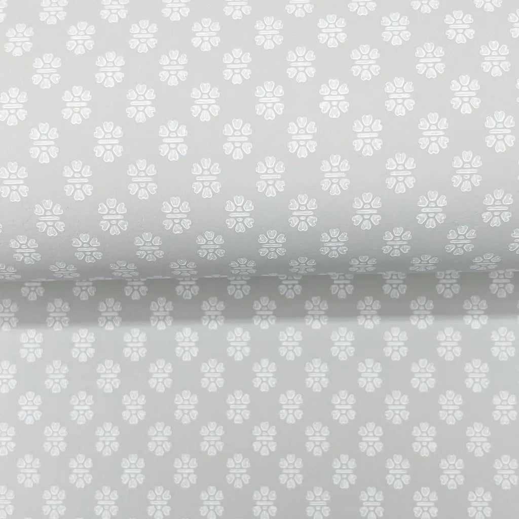 Close-up texture detail of Brioni wallpaper in Grey and White by York Wallcoverings, showcasing its subtle pattern.