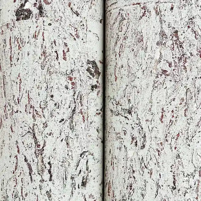 Close-up texture of York Wallcoverings' Warm Ivory Caldera Cork wallpaper, highlighting its natural, organic feel.