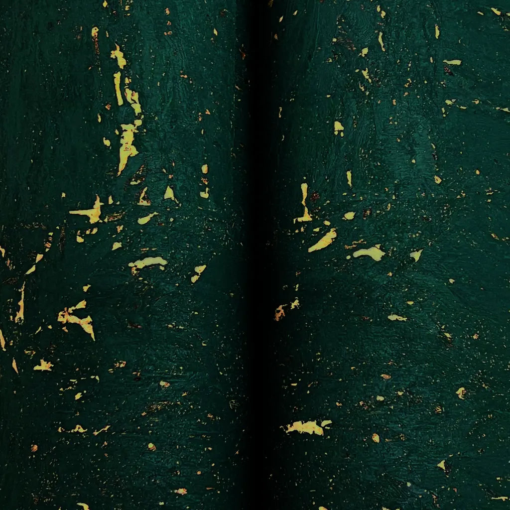 Close-up texture of York Wallcoverings' Caldera Cork wallpaper, showcasing deep green and natural cork fibers.