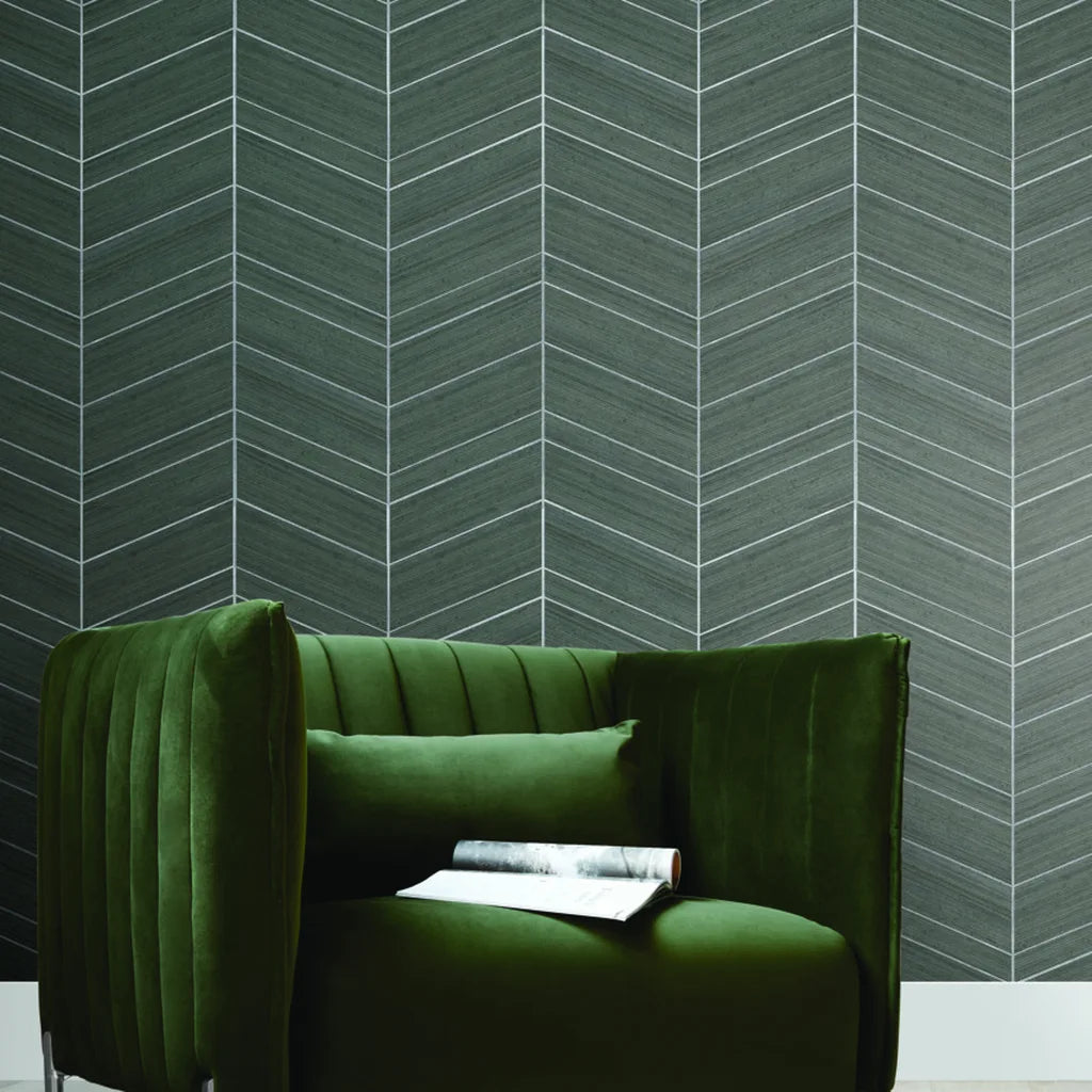 Living room showcasing elegant Chevron Abaca wallpaper in Taupe by York Wallcoverings, adding texture and style.