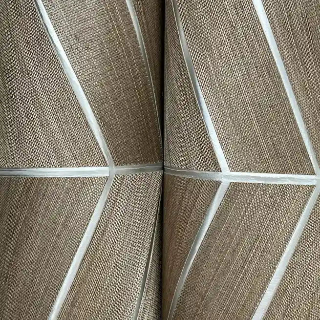 Close-up texture detail of Chevron Abaca wallpaper in subtle taupe, showcasing its natural fiber weave by York Wallcoverings.