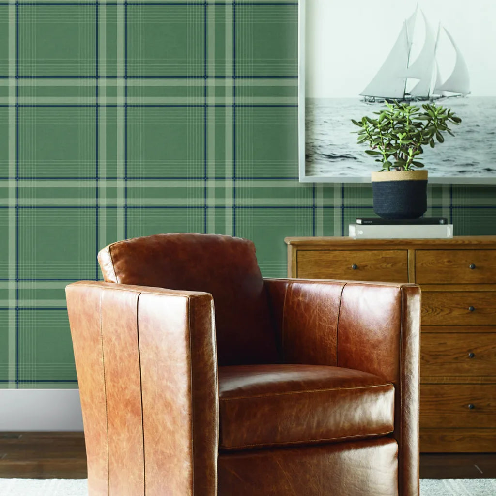 Living room with Country Club Plaid wallpaper in Sage Green by York Wallcoverings, creating a cozy and stylish space.