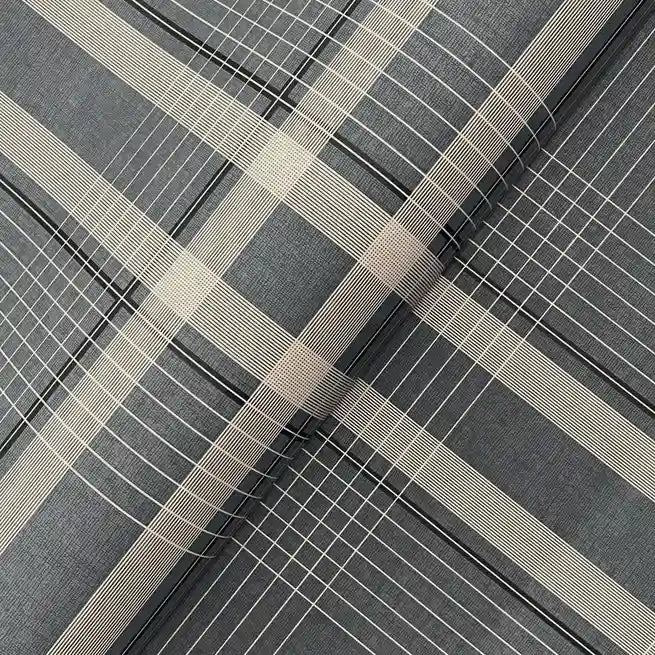 Close-up texture of York Wallcoverings' Country Club Plaid wallpaper in sophisticated Charcoal and Beige.