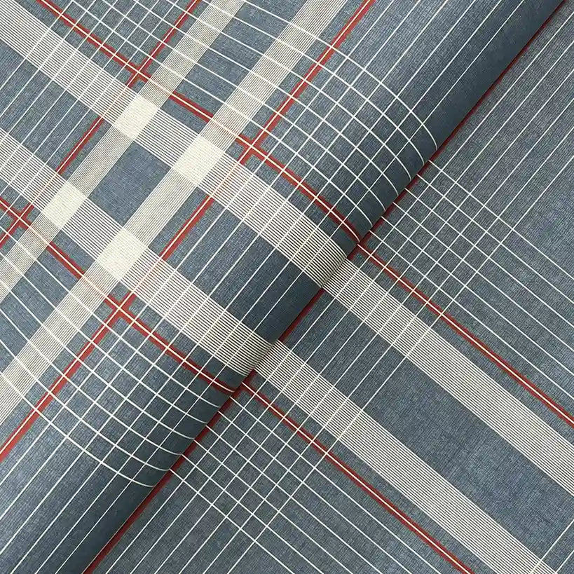 Close-up texture of York Wallcoverings' Country Club Plaid wallpaper in Dusty Blue.
