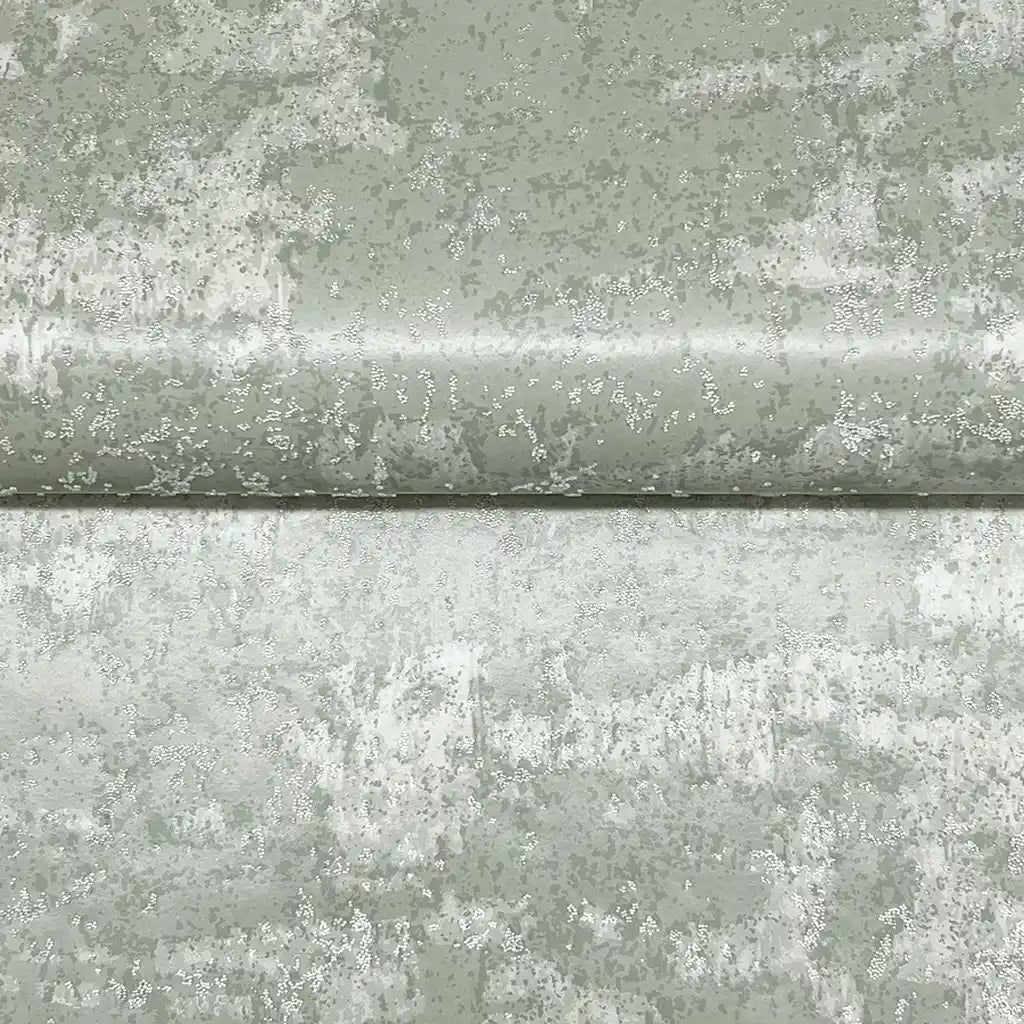Close-up of York Wallcoverings' 'Crystal Cloud' wallpaper, revealing its subtle, shimmering Grey-Green texture and intricate details.