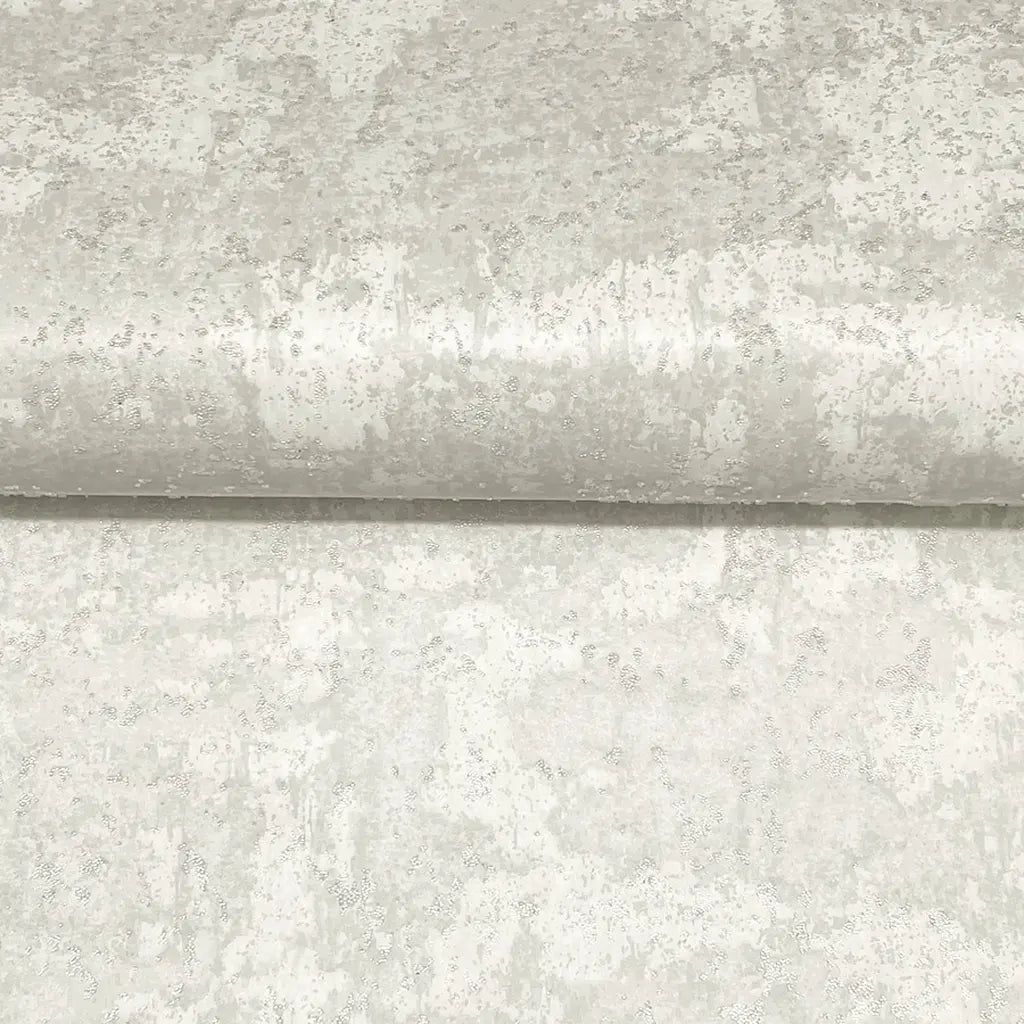Close-up of York Wallcoverings' Crystal Cloud wallpaper in Warm Ivory, highlighting its subtle, elegant textured detail.