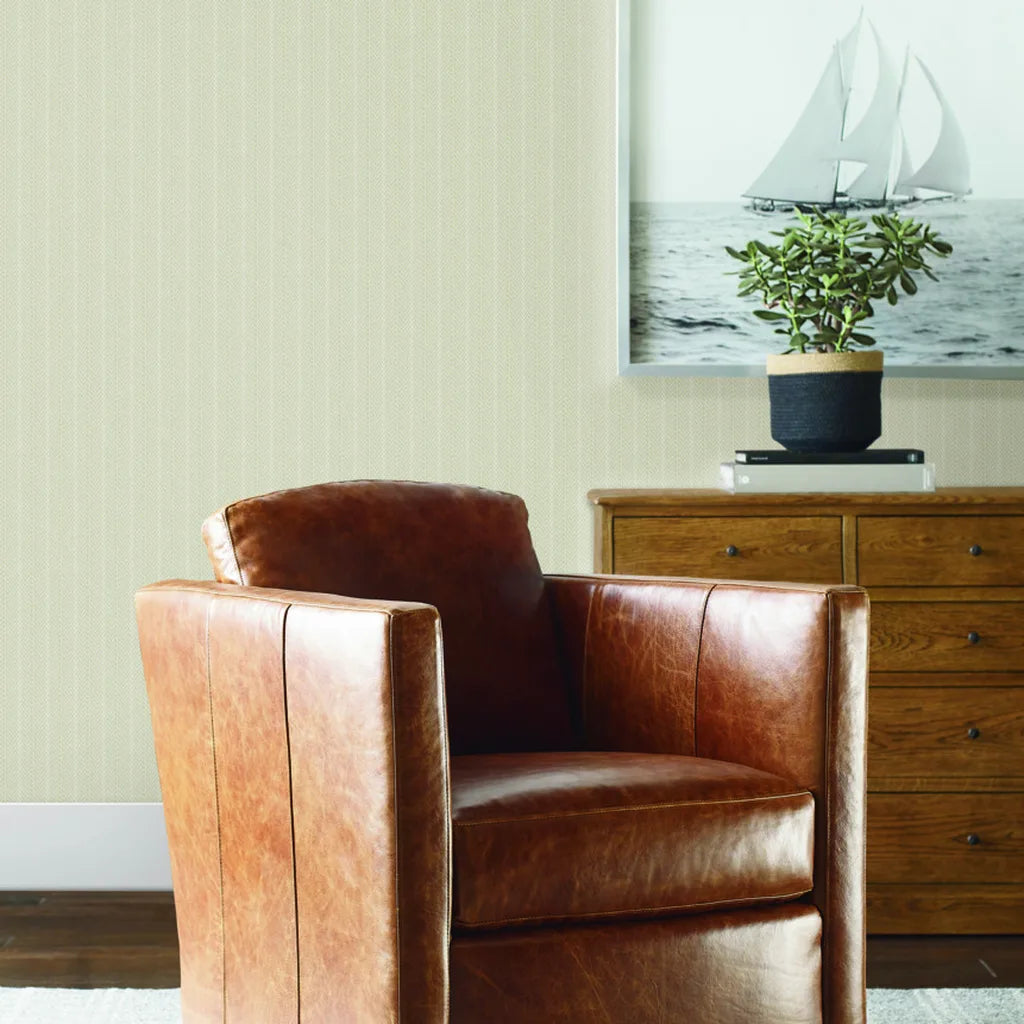Living room features warm beige Elkan Stripe wallpaper by York Wallcoverings, creating a sophisticated and inviting space.
