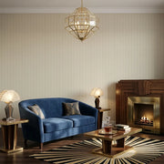 Living Room - Elkan Stripe wallpaper in Warm Beige by York Wallcoverings adds elegant texture to this cozy and inviting space.