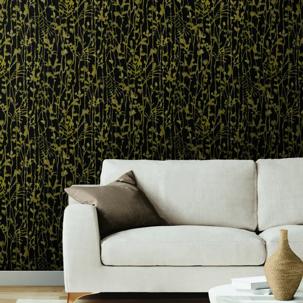 Living room featuring "Filigree" Black and Gold wallpaper by York Wallcoverings, creating an elegant and luxurious space.