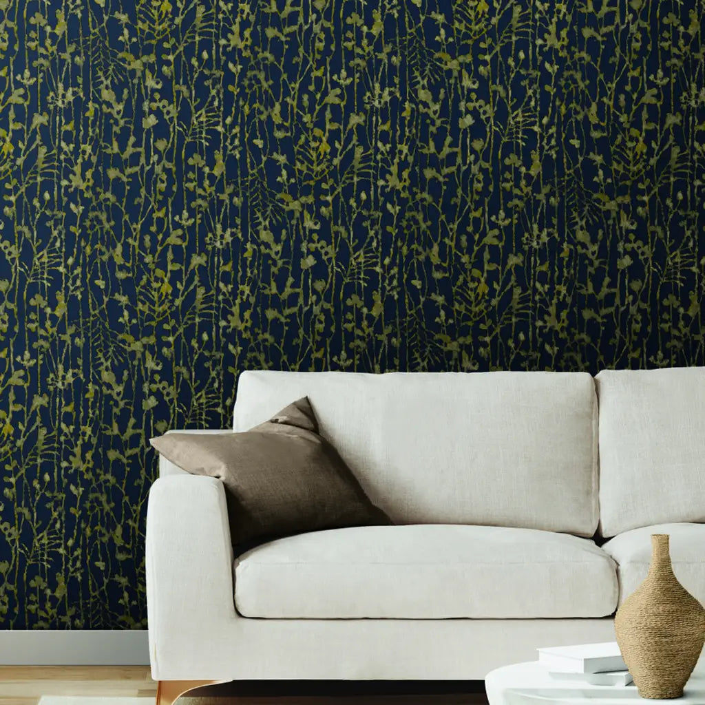 Elegant living room features Navy Gold 'Filigree' wallpaper by York Wallcoverings, adding a luxurious touch to the space.