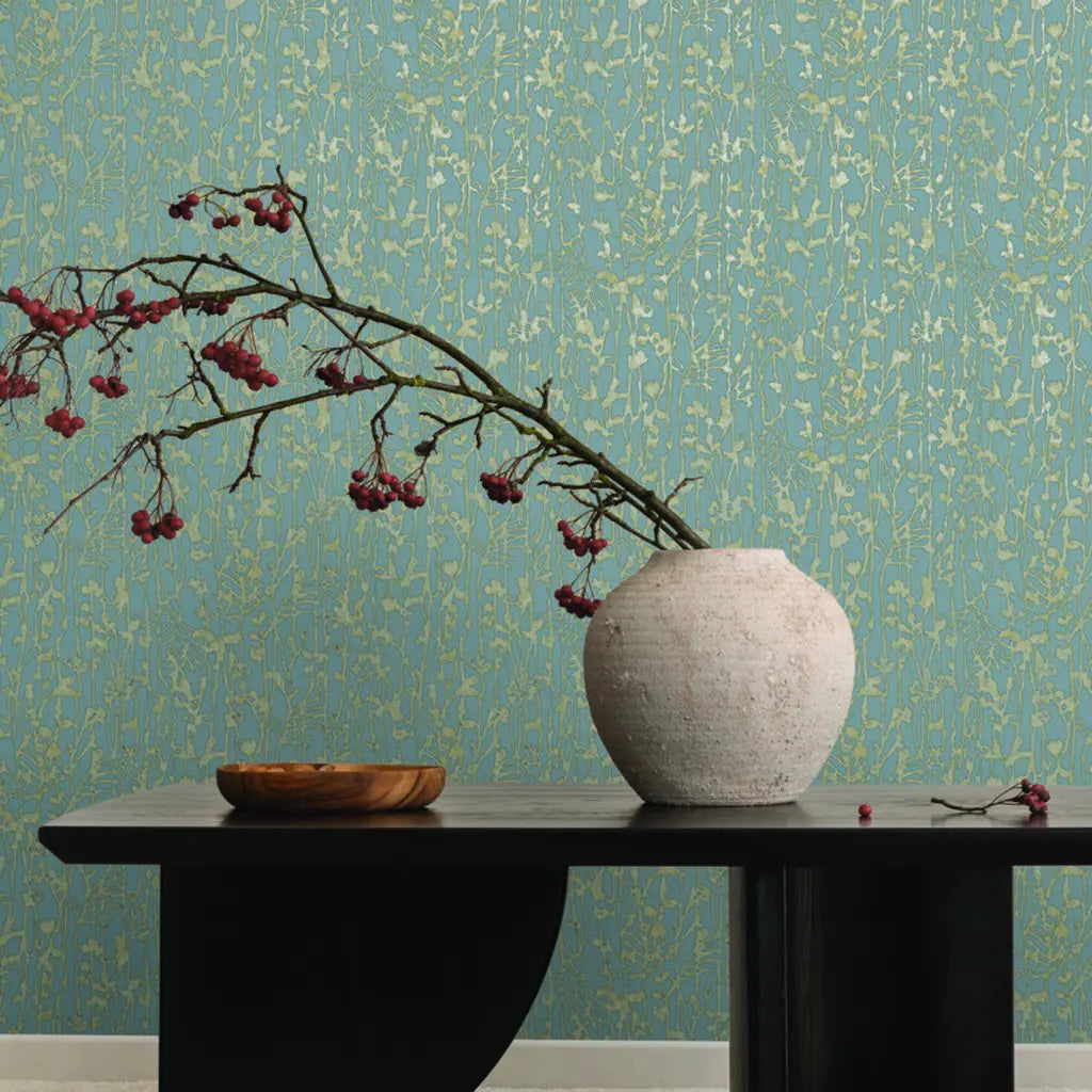 Living room photo showcasing elegant Dusty Blue Filigree wallpaper by York Wallcoverings, creating a serene modern space.