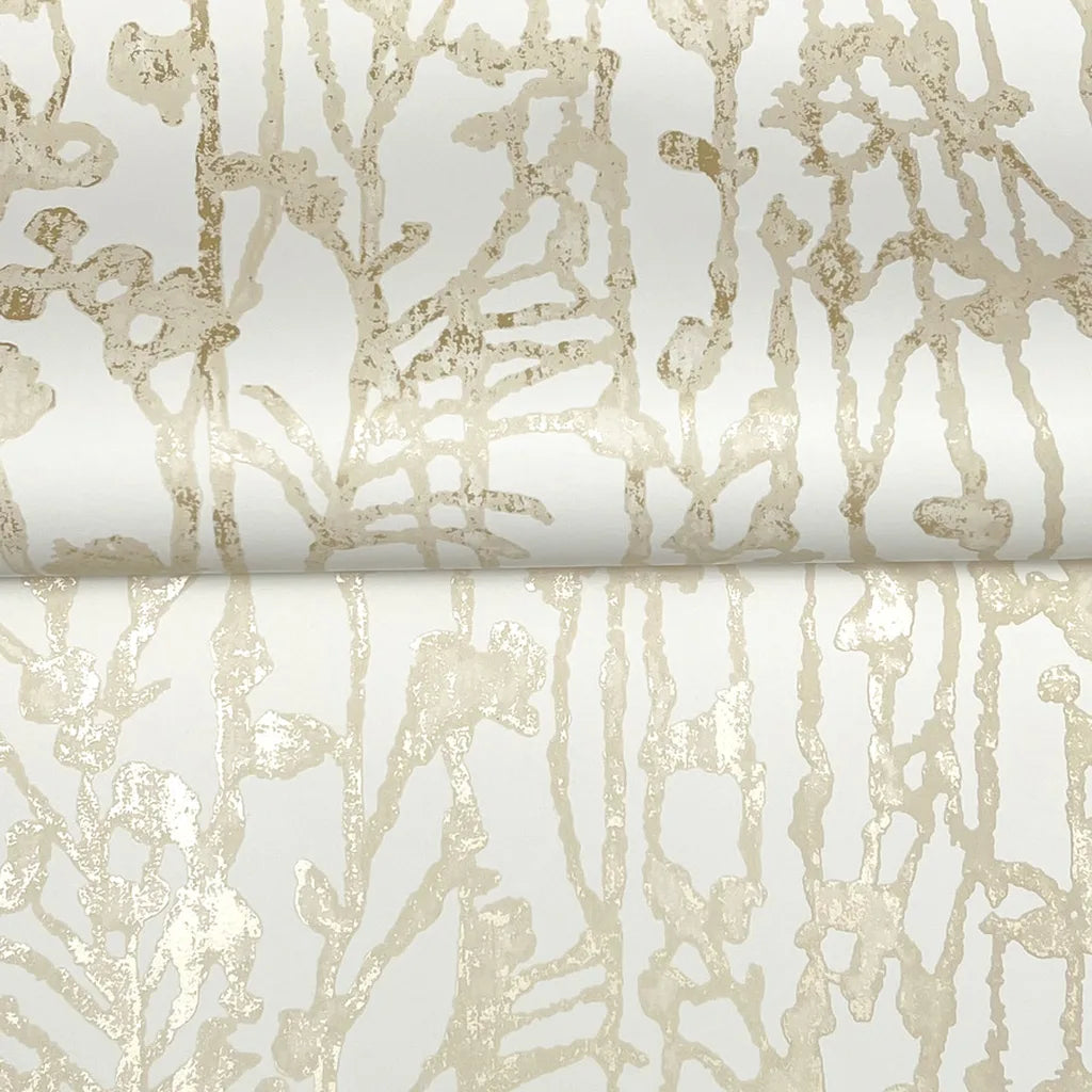 Close-up texture of York Wallcoverings' Filigree wallpaper in Cream Gold, highlighting intricate metallic details.