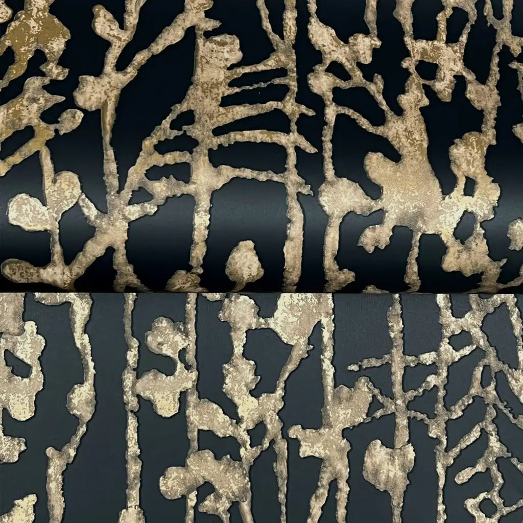 Detailed close-up texture of York Wallcoverings' Filigree wallpaper, showcasing the intricate black and gold pattern.