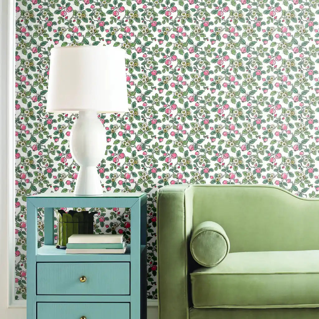 Elegant living room showcasing 'Framboise' pink, green, white floral wallpaper from York Wallcoverings.