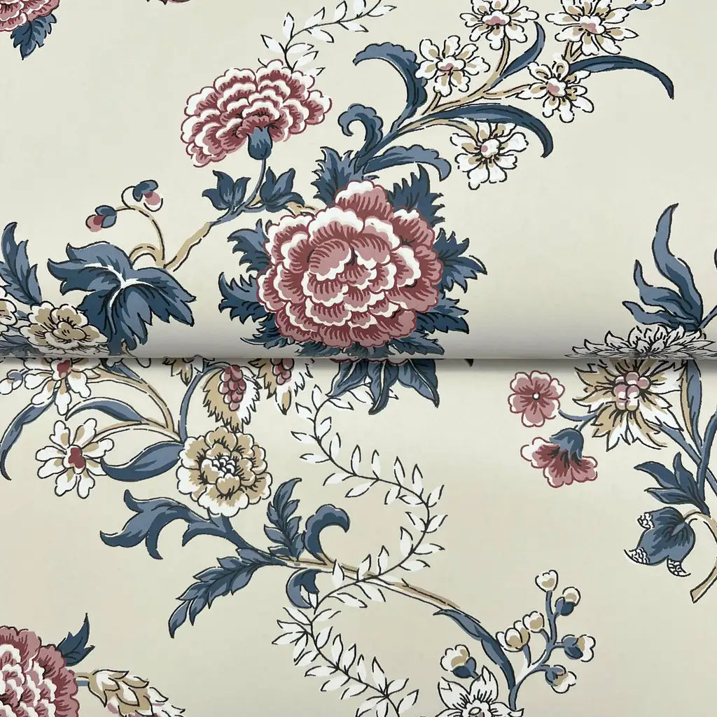 Close-up texture of Genevieve wallpaper by York Wallcoverings, showcasing its pink, beige, and blue intricate design.