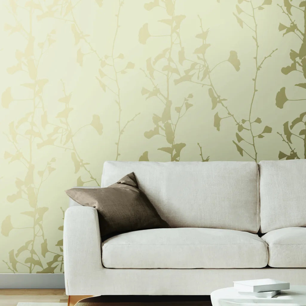 Living room showcasing 'Ginkgo Silhouette' wallpaper in Cream Beige by York Wallcoverings, creating an elegant, serene space.