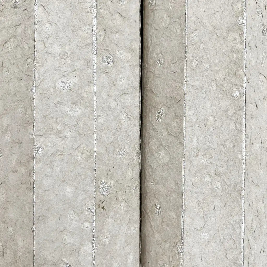Detailed close-up of Handcrafted Paper wallpaper's Warm Ivory texture by York Wallcoverings.