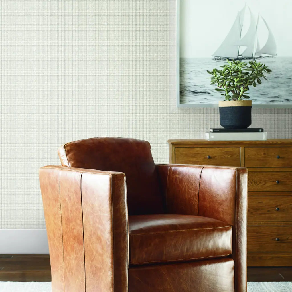 Elegant living room featuring Harrington Plaid wallpaper in Cream and Grey by York Wallcoverings, creating a sophisticated ambiance.