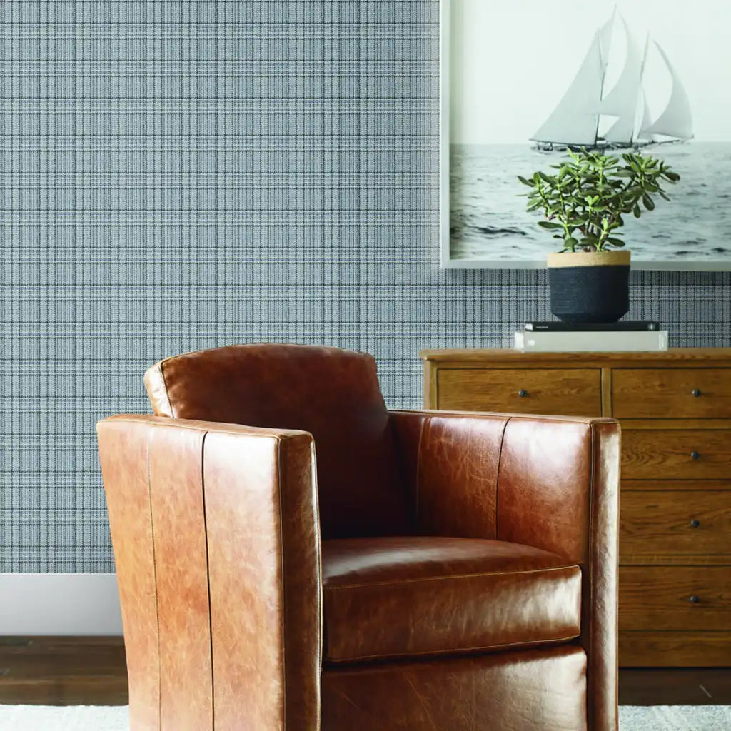 Living room with elegant Harrington Plaid Grey Blue wallpaper by York Wallcoverings, adding classic style and texture.