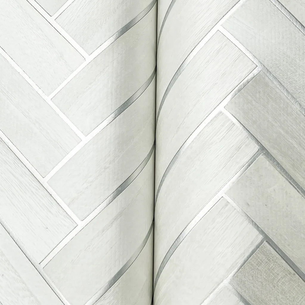 Close-up texture of York Wallcoverings Warm Ivory herringbone wood veneer wallpaper, showcasing the intricate pattern detail.