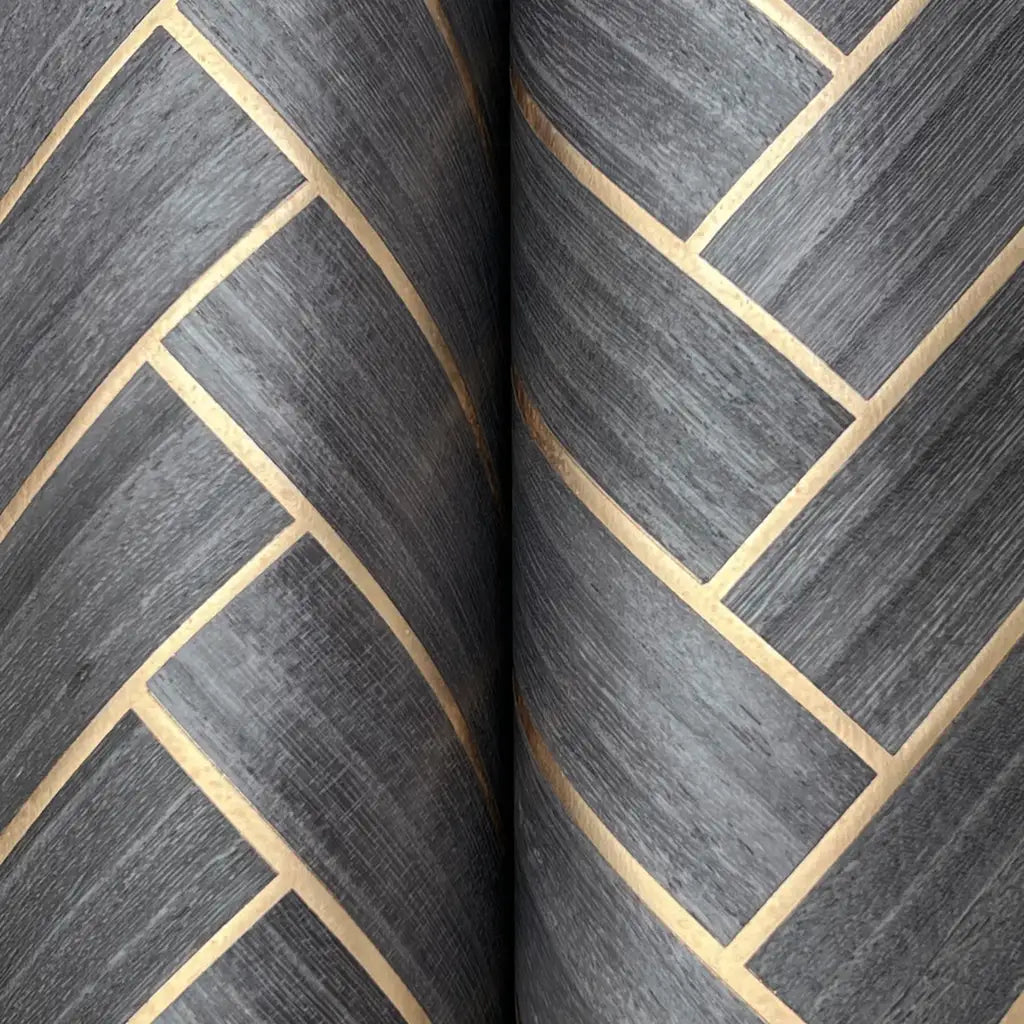 Detailed texture of slate grey and beige herringbone wood veneer wallpaper by York Wallcoverings.