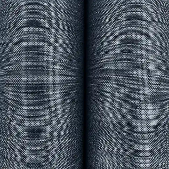 Close-up of York Wallcoverings' Horizon Abaca wallpaper in Slate Blue, showcasing its natural woven texture and intricate fibers.