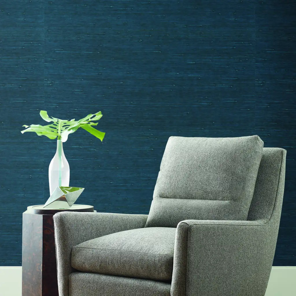 Stylish living room features Dark Teal "Horizontal Jute" wallpaper from York Wallcoverings, adding texture and color.