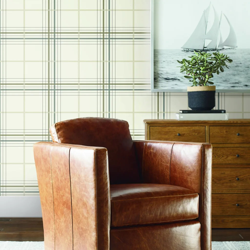Cozy living room showcases elegant Lakeside Plaid wallpaper in warm ivory neutrals by York Wallcoverings.