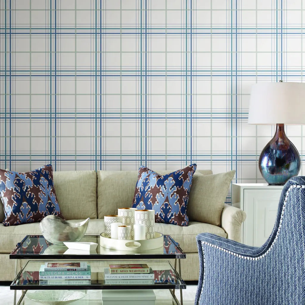 Cozy living room showcases elegant Blue and Grey 'Lakeside Plaid' wallpaper by York Wallcoverings, adding a sophisticated touch.