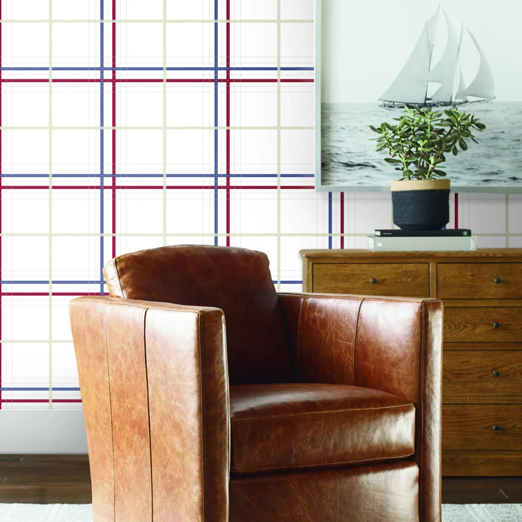 Living room showcasing York Wallcoverings' Lakeside Plaid wallpaper in Burgundy, Navy, and Beige, adding warmth to the space.