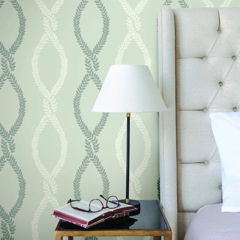 A serene bedroom featuring elegant Grey Laureate wallpaper by York Wallcoverings, creating a peaceful and stylish retreat.