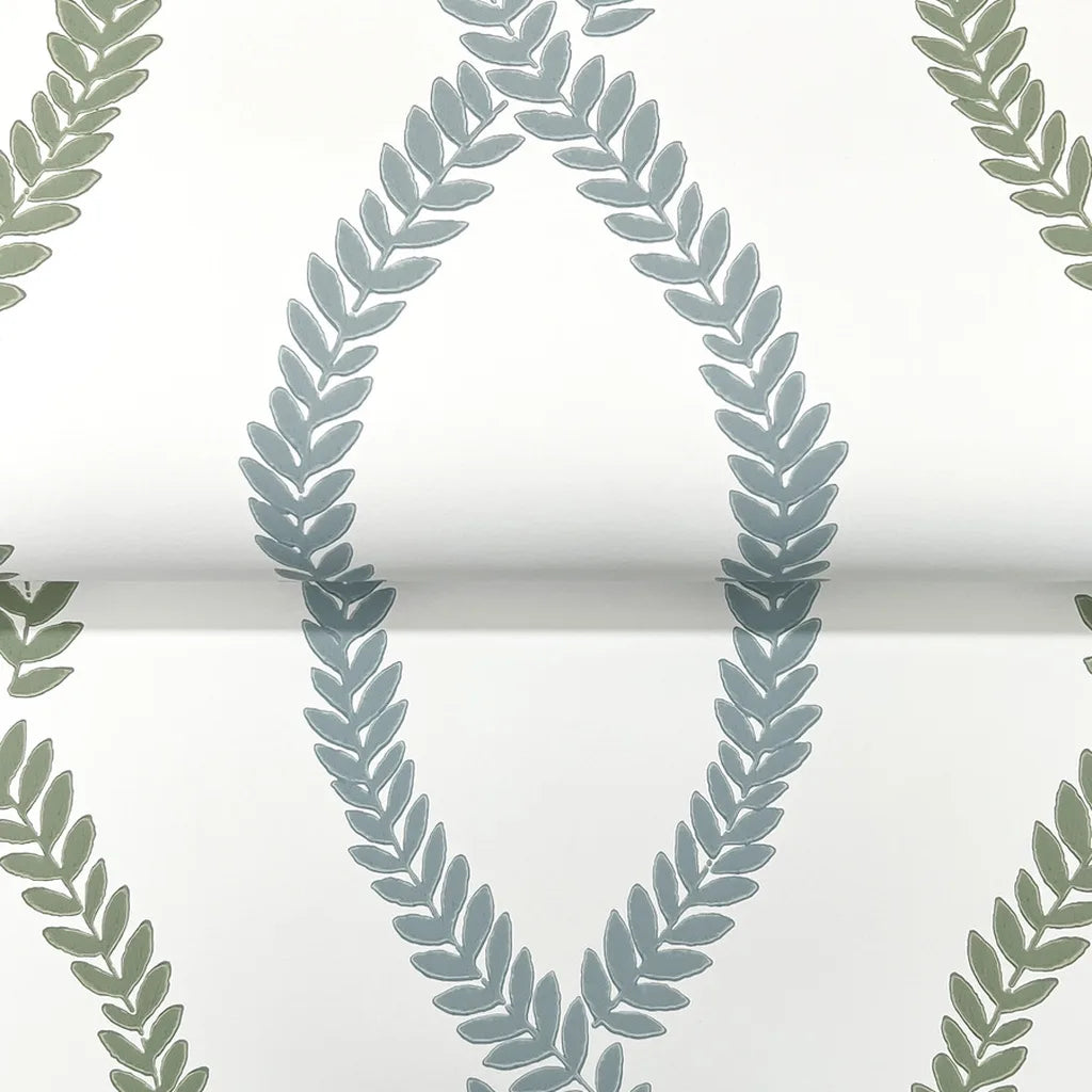 Close-up texture detail of Laureate wallpaper by York Wallcoverings, showcasing its intricate pattern in green and blue hues.