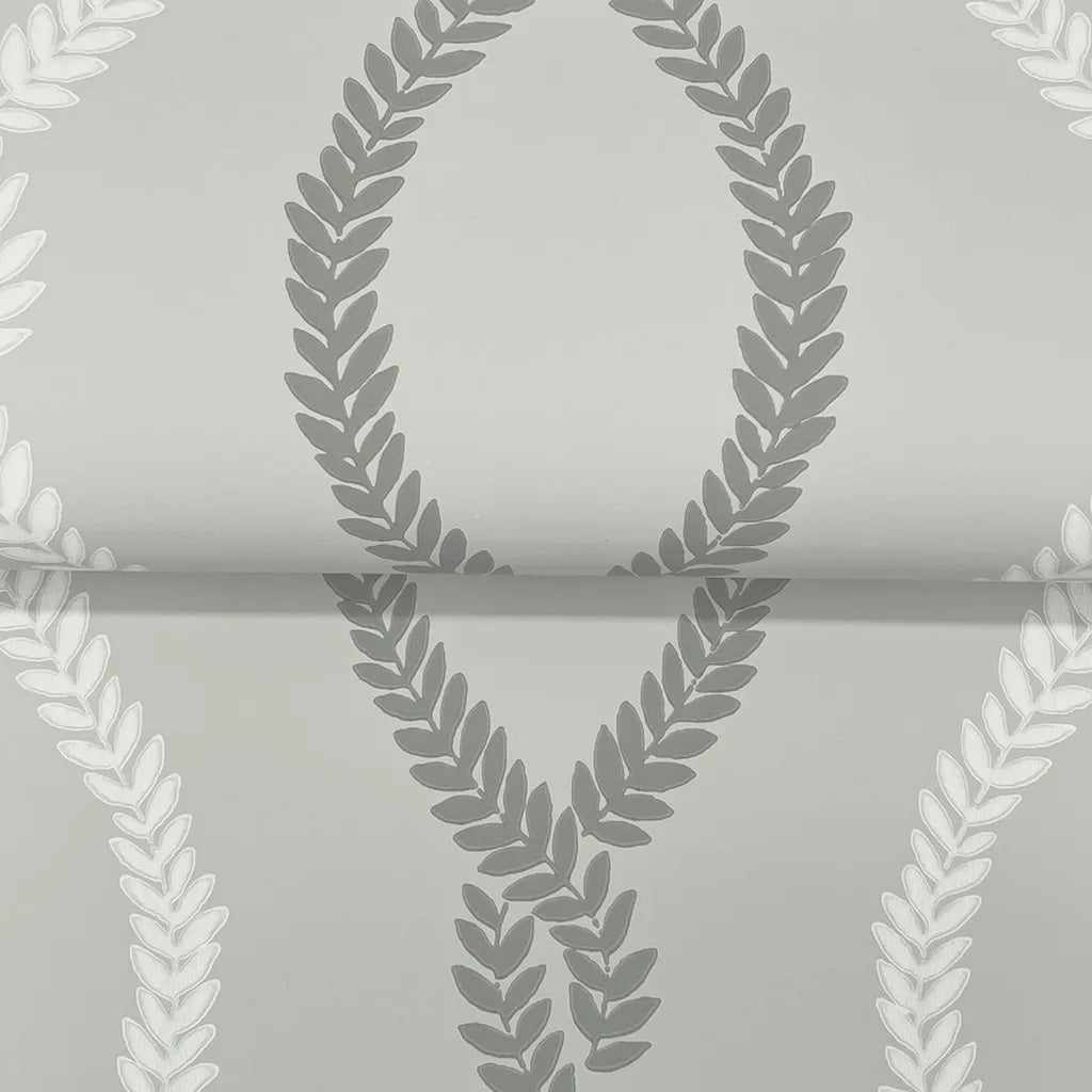 Close-up of York Wallcoverings' 'Laureate' grey wallpaper texture, revealing its elegant, subtle woven pattern.