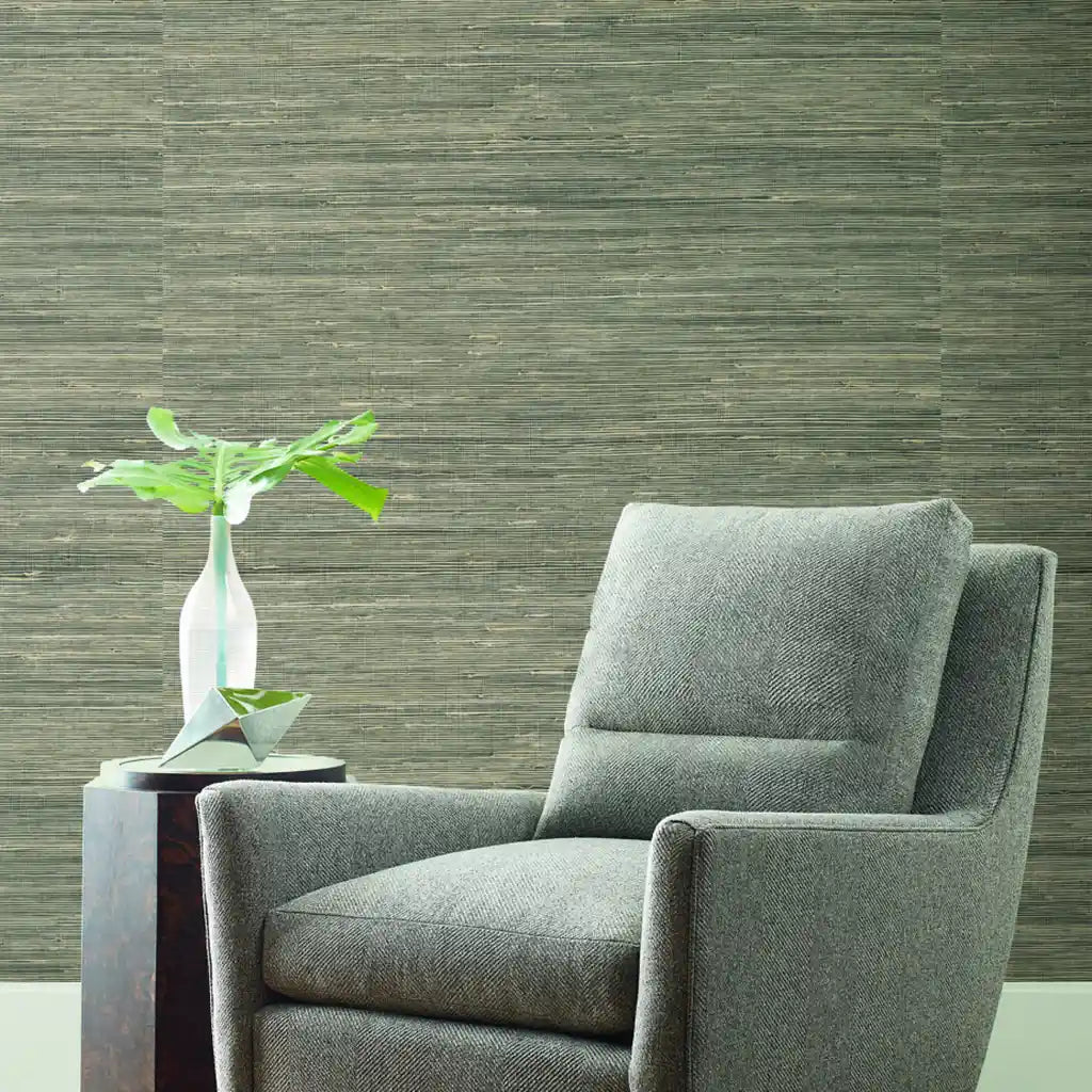 Living room with stunning "Oceanside Grass" wallpaper in Seafoam Beige by York Wallcoverings, creating a serene space.